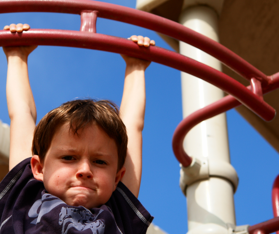 Website Value Determination A kid is hanging on to monkey bars, looking strained from the effort